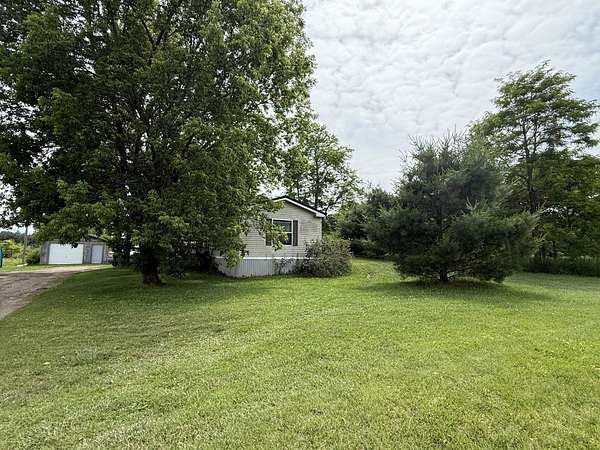 20 Acres of Recreational Land with Home for Sale in Alger, Michigan