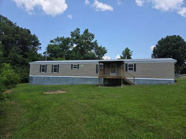 1.68 Acres of Land with Home for Sale in Hohenwald, Tennessee