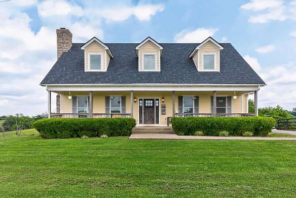 87.9 Acres of Agricultural Land with Home for Sale in Paris, Kentucky