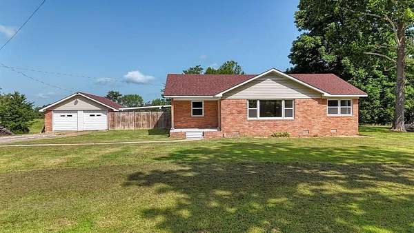 1.62 Acres of Land with Home for Sale in Hollow Rock, Tennessee