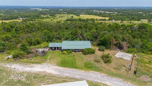 4.49 Acres of Land with Home for Sale in Springtown, Texas