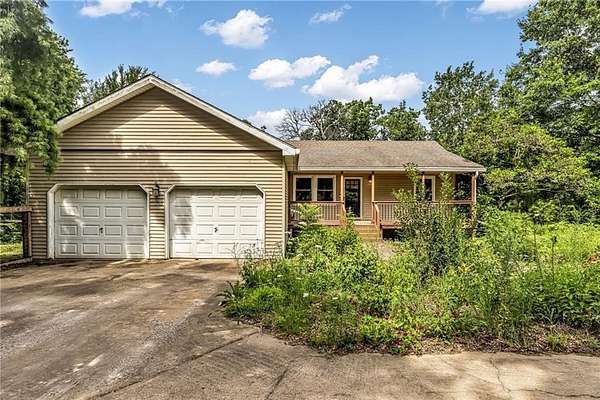 10.7 Acres of Land with Home for Sale in Drexel, Missouri
