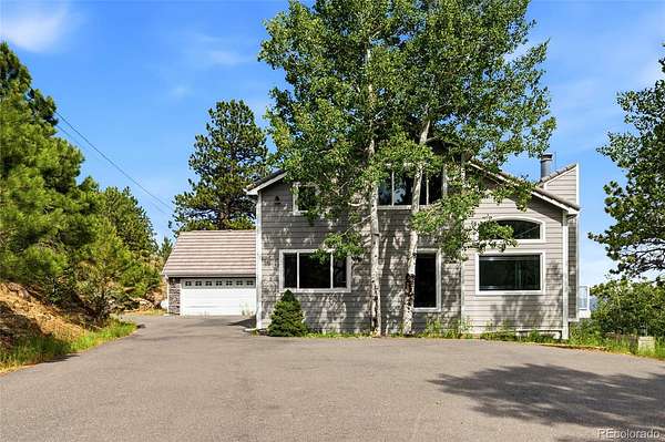 5 Acres of Land with Home for Sale in Evergreen, Colorado