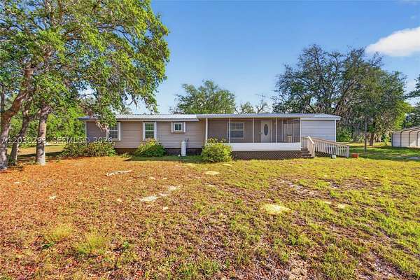4.84 Acres of Land with Home for Sale in Archer, Florida