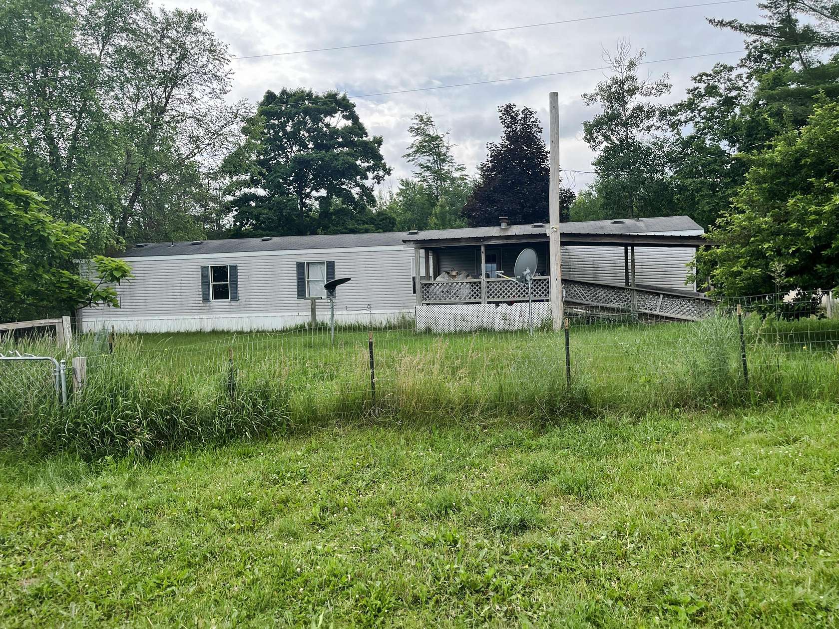 1.5 Acres of Land with Home for Sale in Marion, Michigan