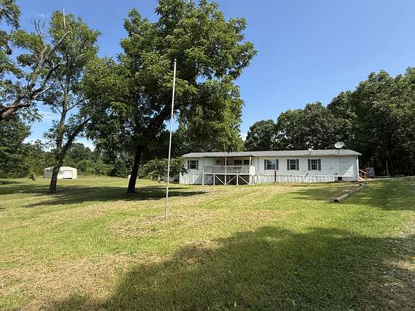 28 Acres of Land with Home for Sale in Peace Valley, Missouri