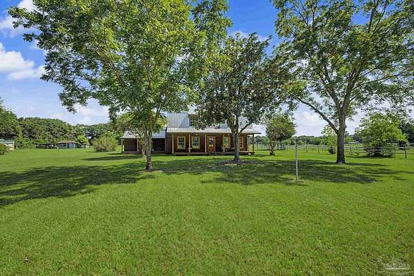 2.44 Acres of Land with Home for Sale in Milton, Florida