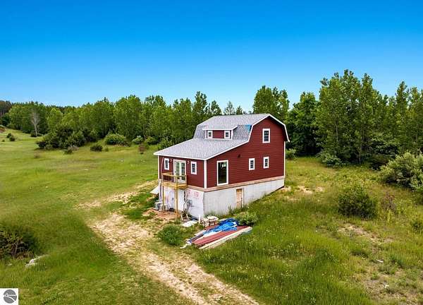 11.6 Acres of Recreational Land with Home for Sale in Bear Lake, Michigan