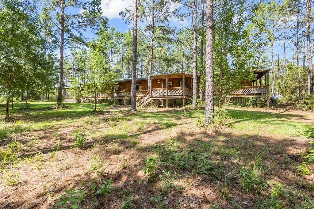 69.9 Acres of Recreational Land with Home for Sale in Livingston, Texas