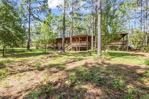 69.9 Acres of Recreational Land with Home for Sale in Livingston, Texas