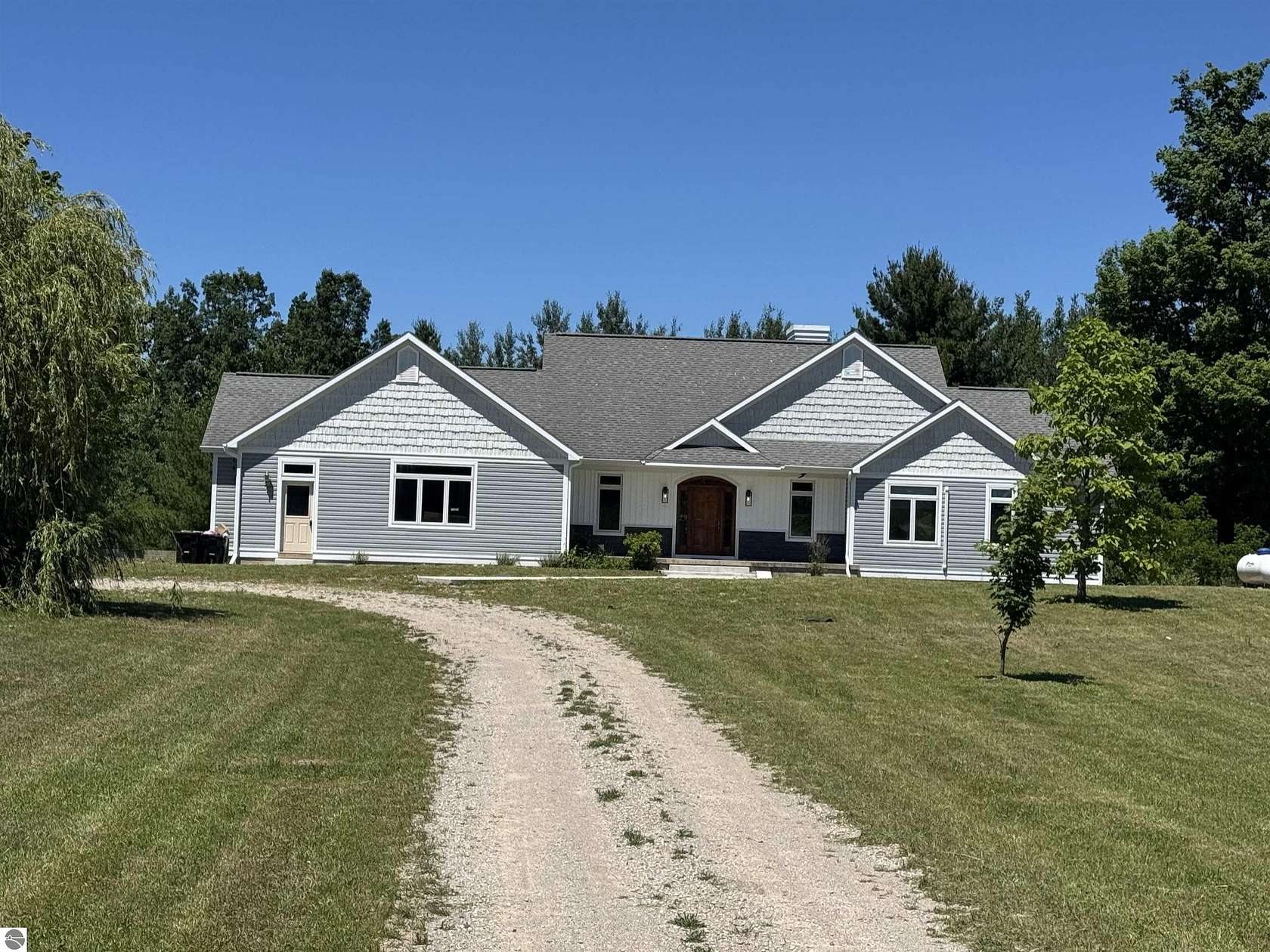 13 Acres of Land with Home for Sale in Williamsburg, Michigan