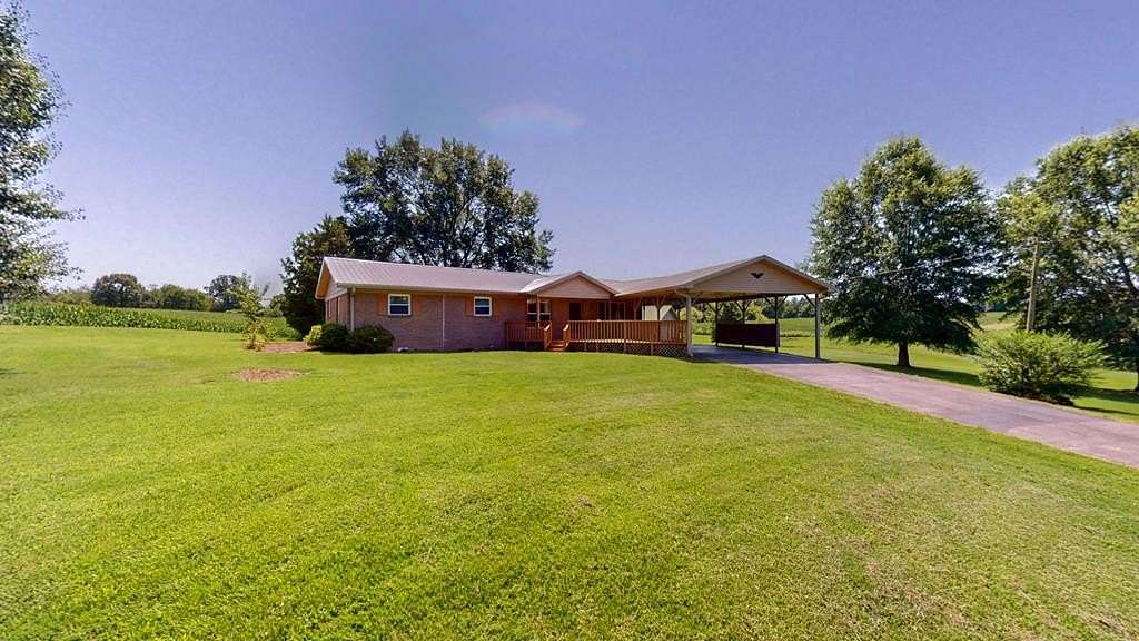 5 Acres of Land with Home for Sale in Hollow Rock, Tennessee