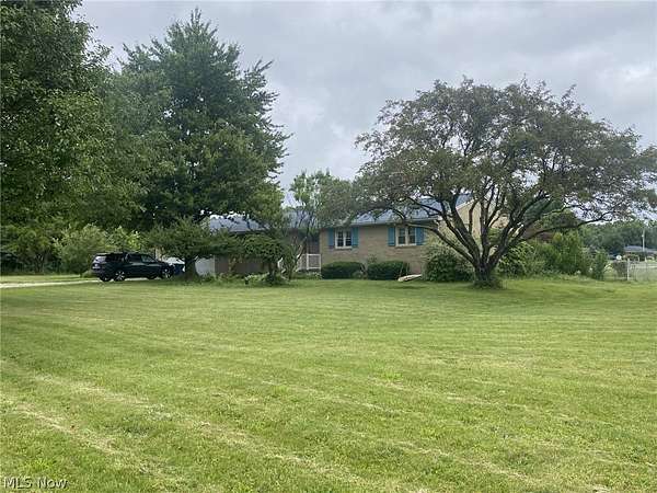1.5 Acres of Land with Home for Sale in Louisville, Ohio