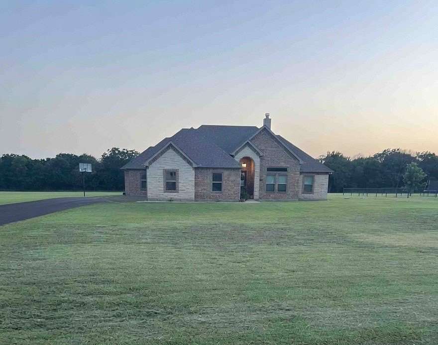 1.66 Acres of Land with Home for Sale in Grandview, Texas