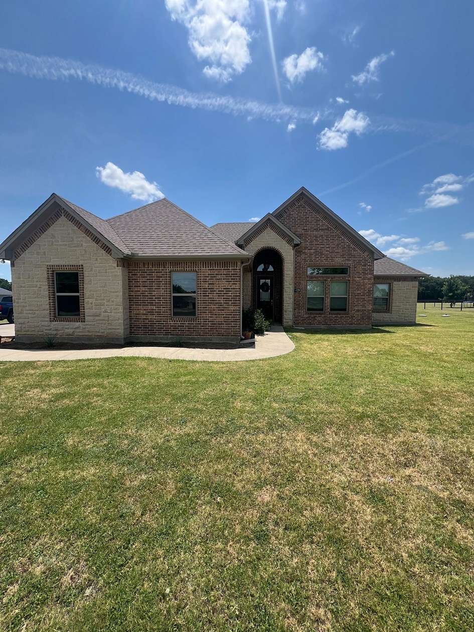 1.66 Acres of Land with Home for Sale in Grandview, Texas