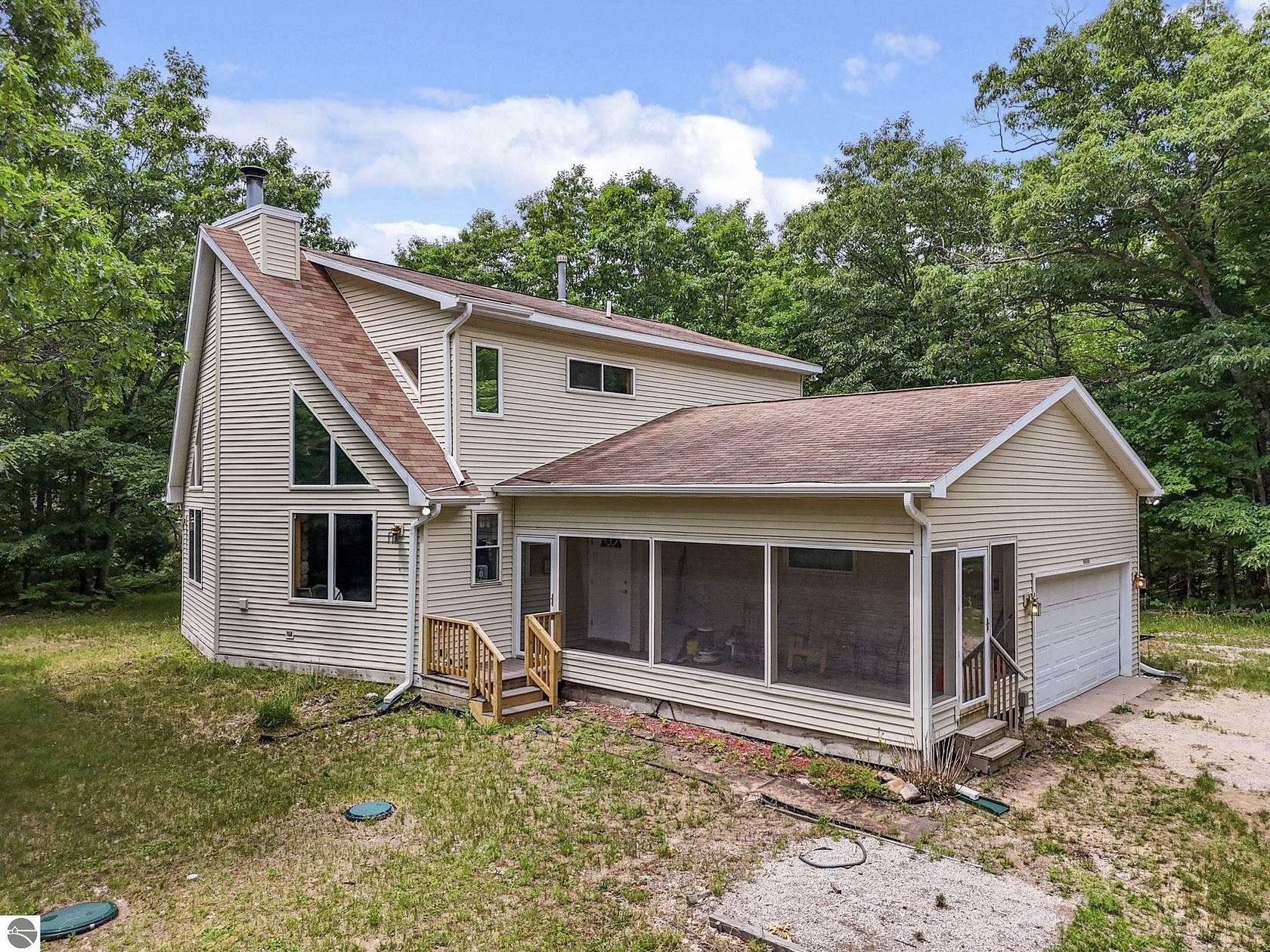 7 Acres of Land with Home for Sale in Interlochen, Michigan