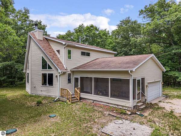 7 Acres of Land with Home for Sale in Interlochen, Michigan