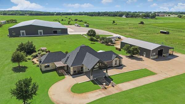 23 Acres of Agricultural Land with Home for Sale in Pilot Point, Texas