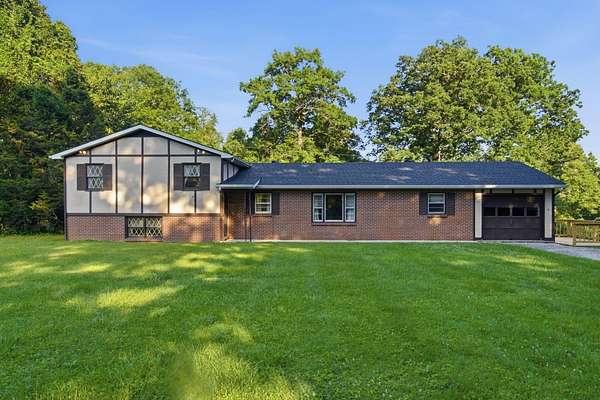 15.4 Acres of Land with Home for Sale in Beattyville, Kentucky