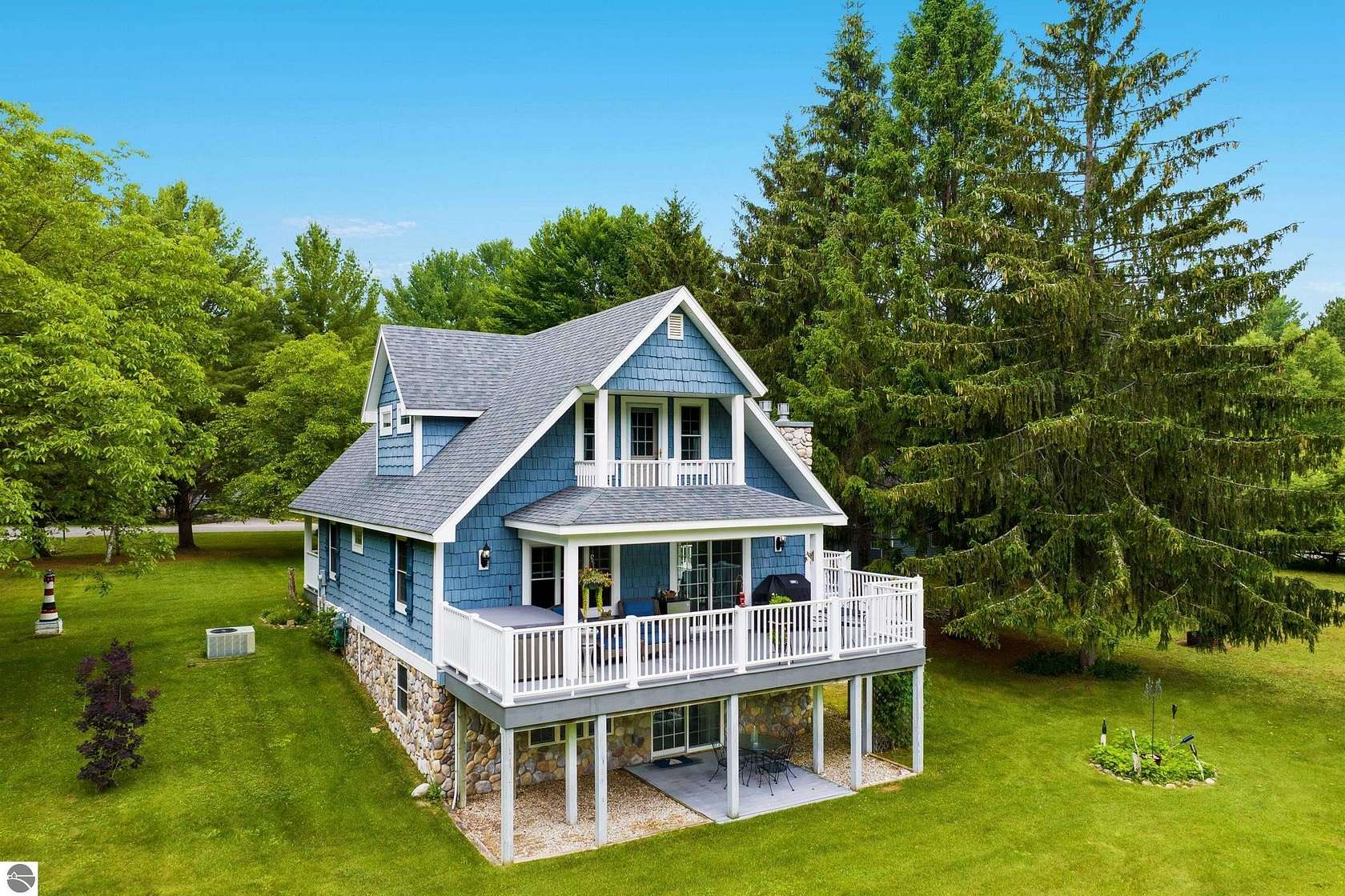 1.6 Acres of Land with Home for Sale in Kewadin, Michigan