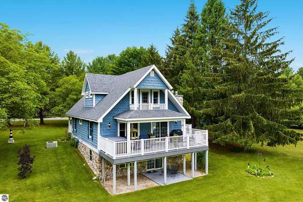 1.6 Acres of Land with Home for Sale in Kewadin, Michigan