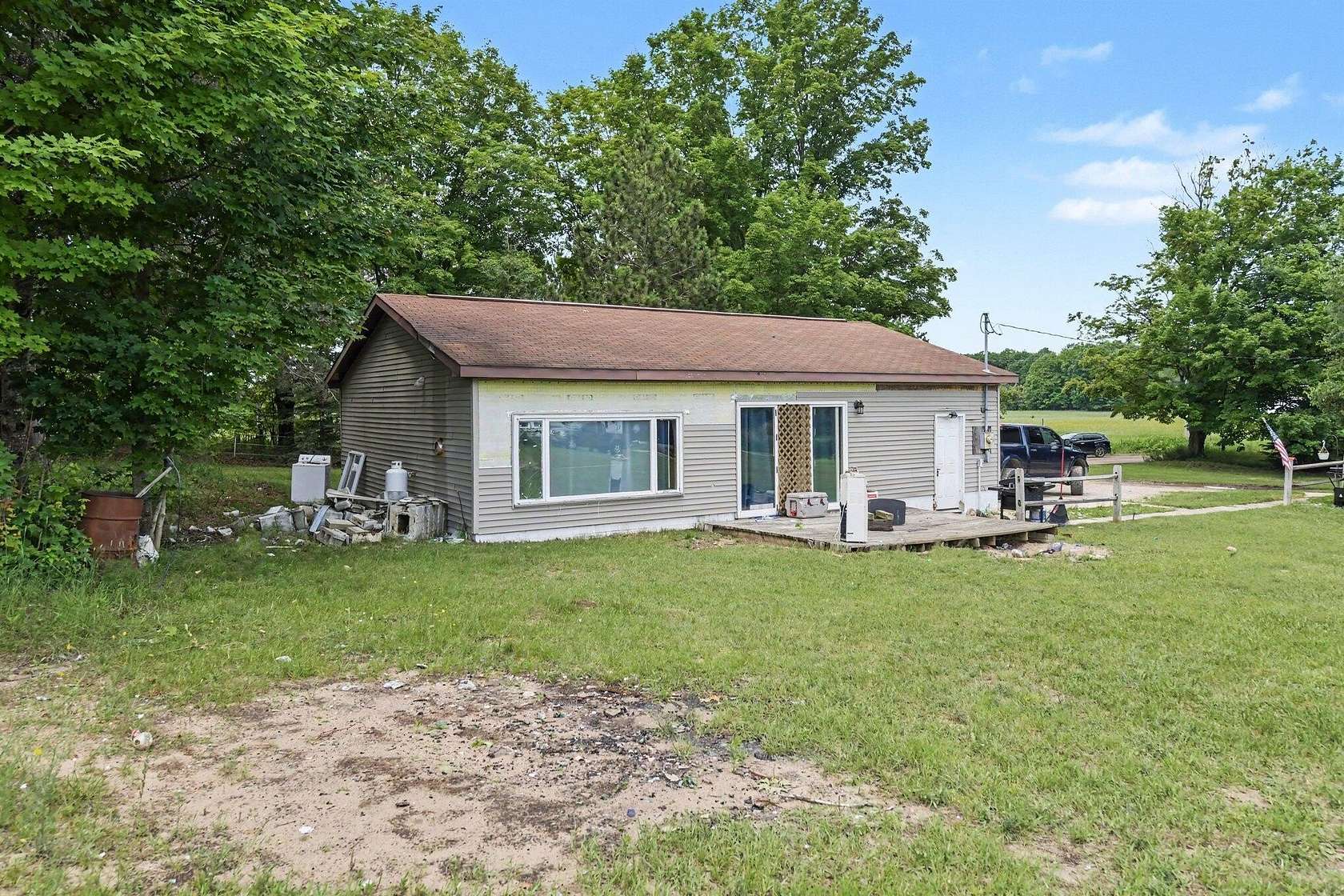 10 Acres of Land with Home for Sale in Rapid City, Michigan