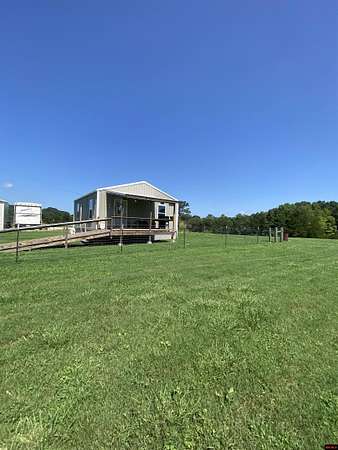 16.7 Acres of Land with Home for Sale in Marshall, Arkansas