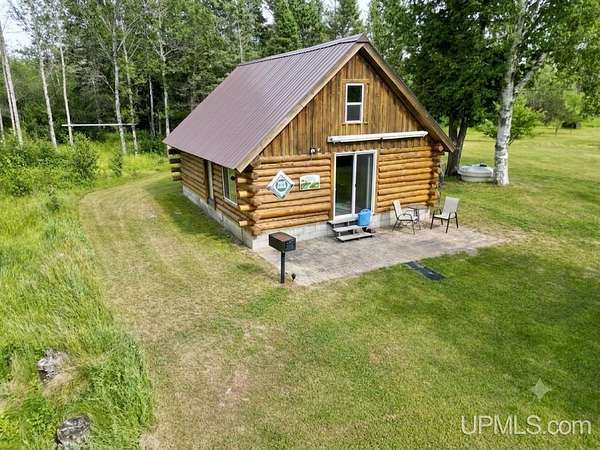 60 Acres of Recreational Land with Home for Sale in Rapid River, Michigan