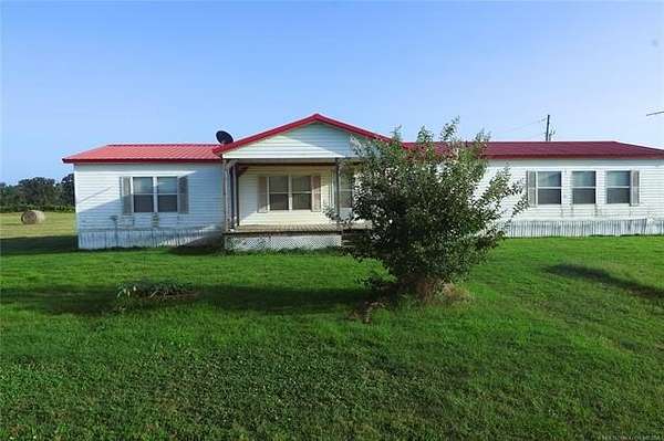 80 Acres of Agricultural Land with Home for Sale in McCurtain, Oklahoma