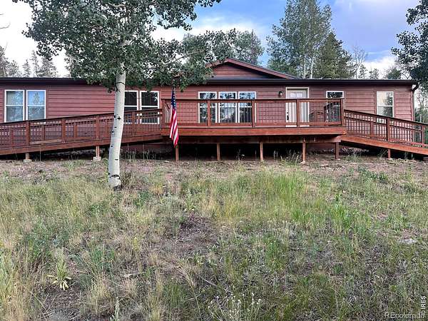 2.57 Acres of Land with Home for Sale in Red Feather Lakes, Colorado