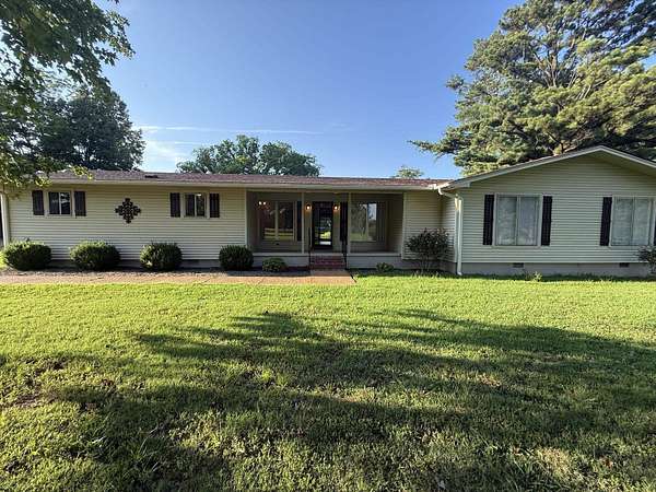 9.78 Acres of Land with Home for Sale in Covington, Tennessee