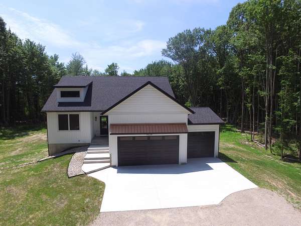 6.8 Acres of Land with Home for Sale in Spring Lake, Michigan