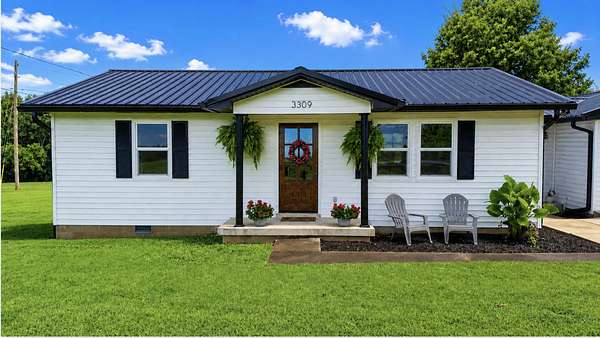 3.29 Acres of Land with Home for Sale in Santa Fe, Tennessee