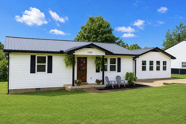 3.29 Acres of Land with Home for Sale in Santa Fe, Tennessee