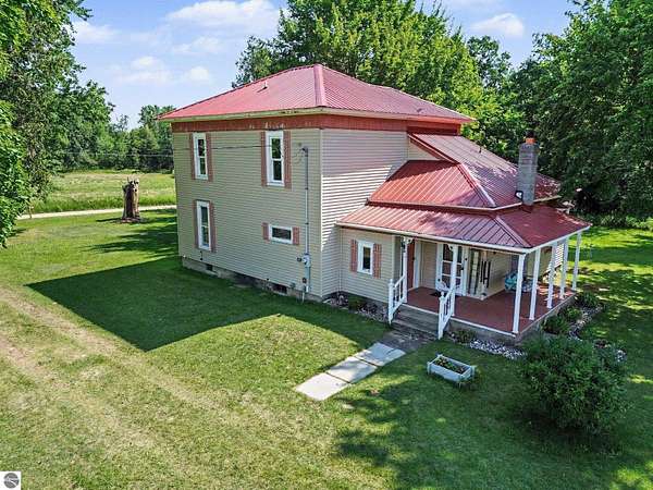 1.5 Acres of Land with Home for Sale in Shepherd, Michigan