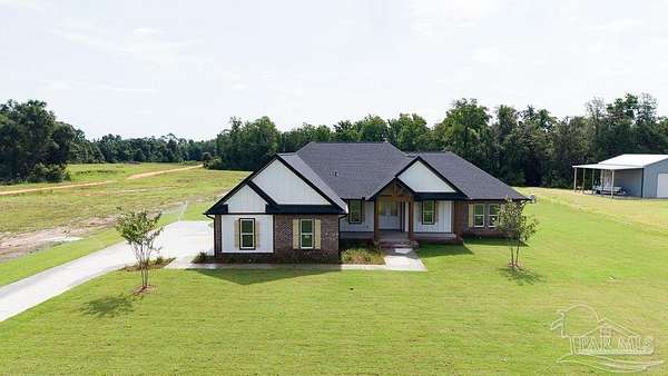 5 Acres of Land with Home for Sale in Jay, Florida