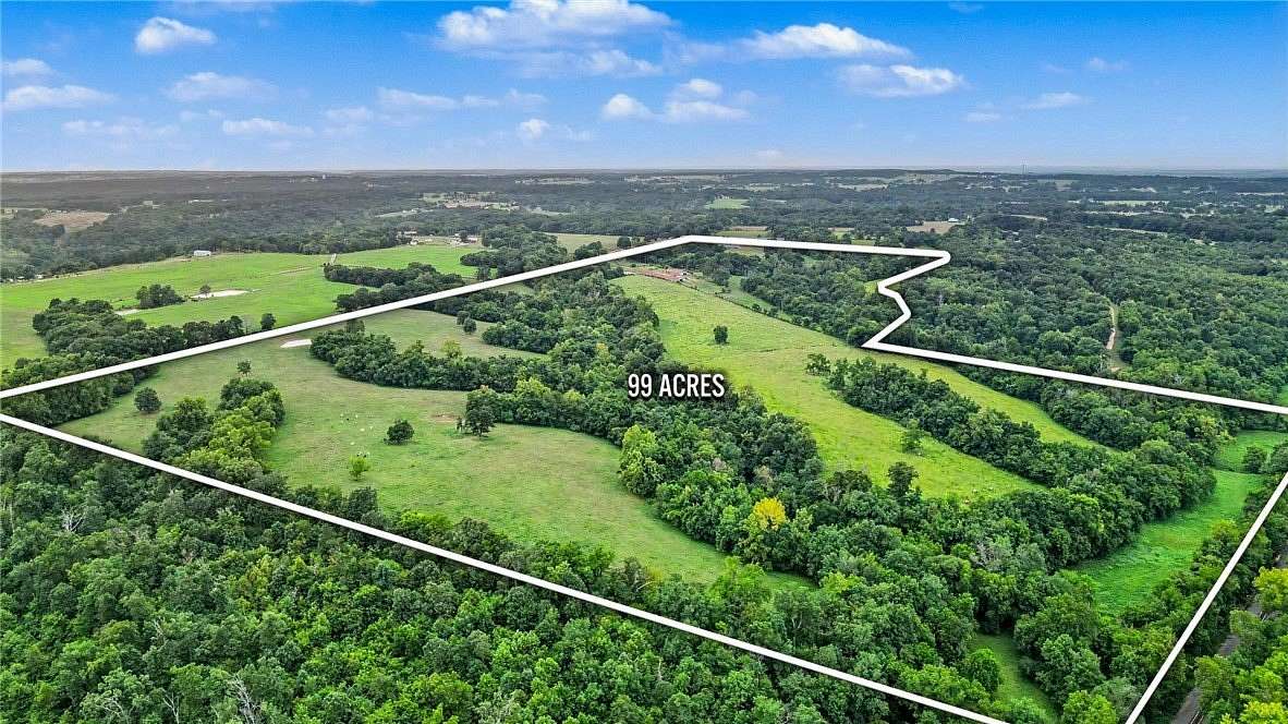 99.4 Acres of Land with Home for Auction in Gravette, Arkansas