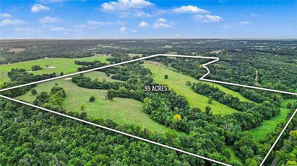 99.4 Acres of Land with Home for Auction in Gravette, Arkansas