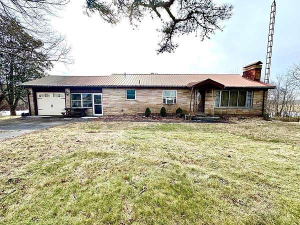 2.45 Acres of Land with Home for Sale in Deer Lodge, Tennessee