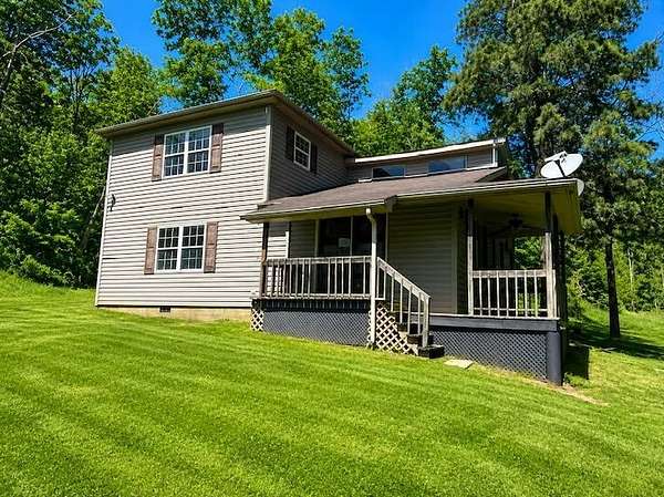 9.68 Acres of Land with Home for Auction in Chesapeake, Ohio