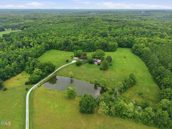 29.6 Acres of Agricultural Land with Home for Sale in Bahama, North Carolina