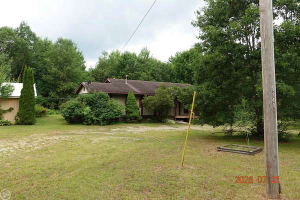 10 Acres of Land with Home for Sale in Harrison, Michigan
