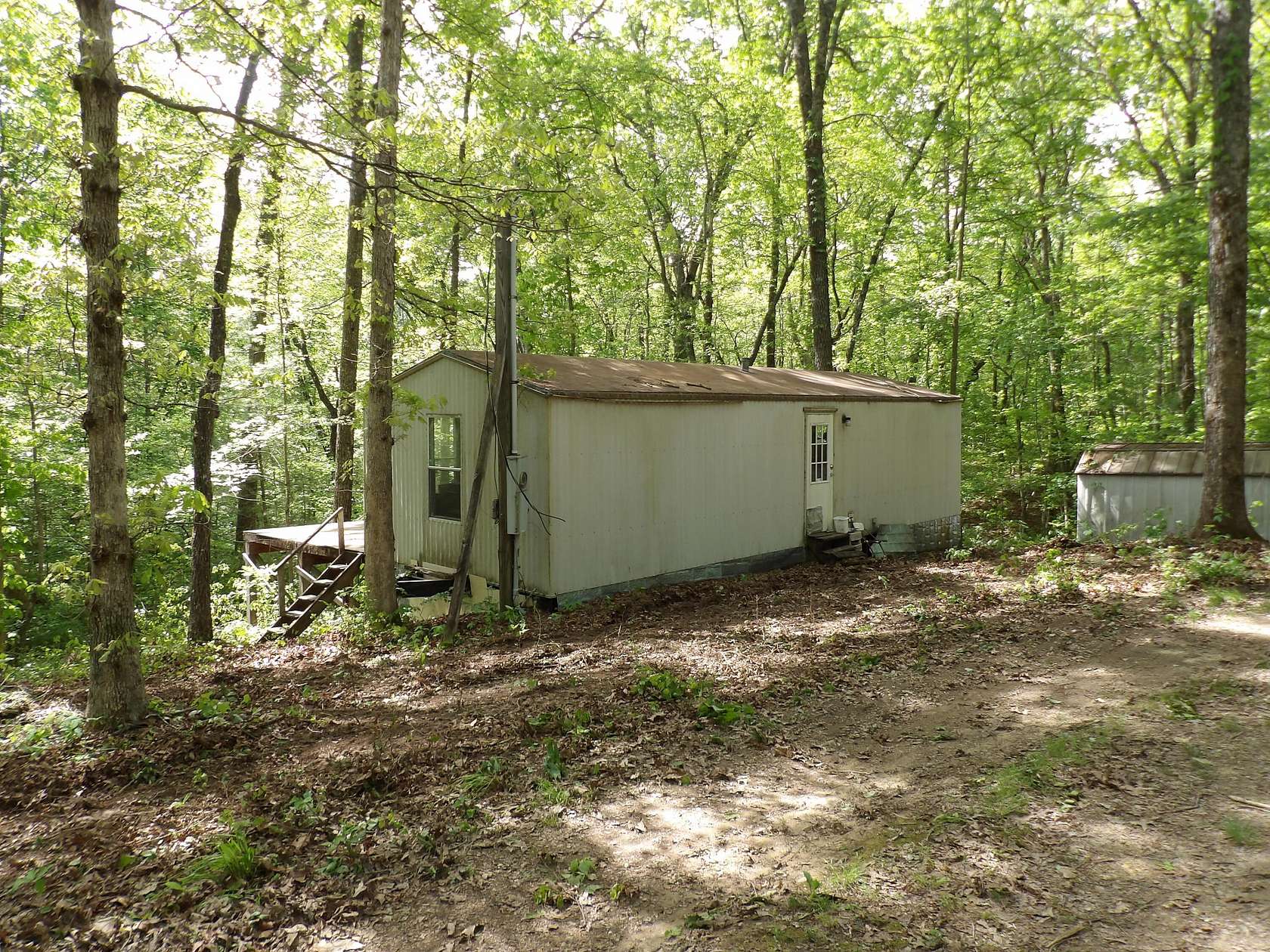 6.6 Acres of Land with Home for Sale in Pikeville, Tennessee