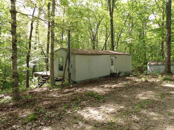 6.6 Acres of Land with Home for Sale in Pikeville, Tennessee