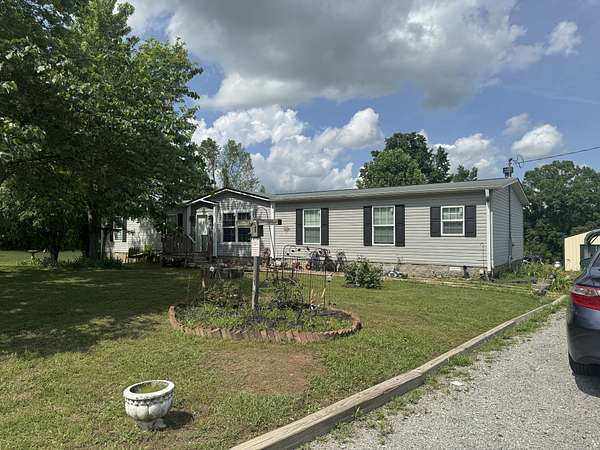 1.69 Acres of Land with Home for Sale in Bon Aqua, Tennessee