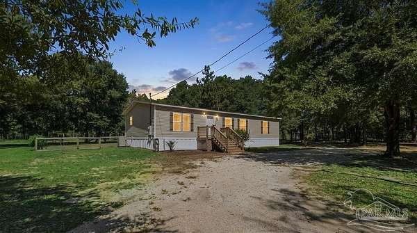 20 Acres of Agricultural Land with Home for Sale in Century, Florida