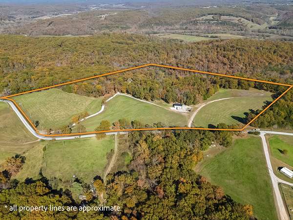 32 Acres of Recreational Land with Home for Sale in Crane, Missouri