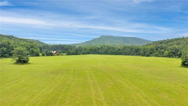 65 Acres of Land with Home for Sale in Combs, Arkansas