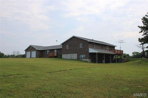 31.7 Acres of Land with Home for Sale in Santa Fe, Missouri