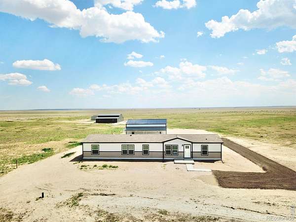 8.23 Acres of Land with Home for Sale in Briggsdale, Colorado
